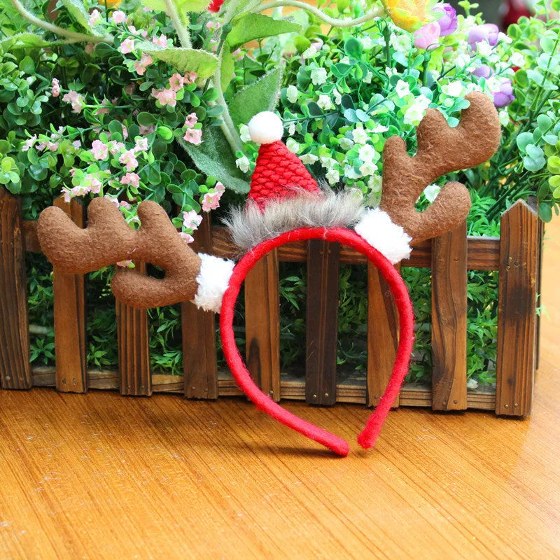 Five Christmas head buckles in different styles including hat, top hat, giraffe, deer, and antlers, made of plastic and flannel