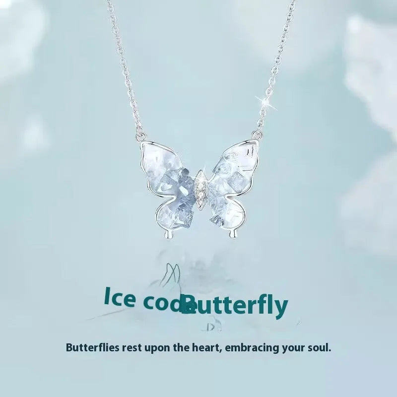 Bingyu adjustable silver butterfly necklace on a dark background, showing the icy electroplated pendant and O-ring chain.