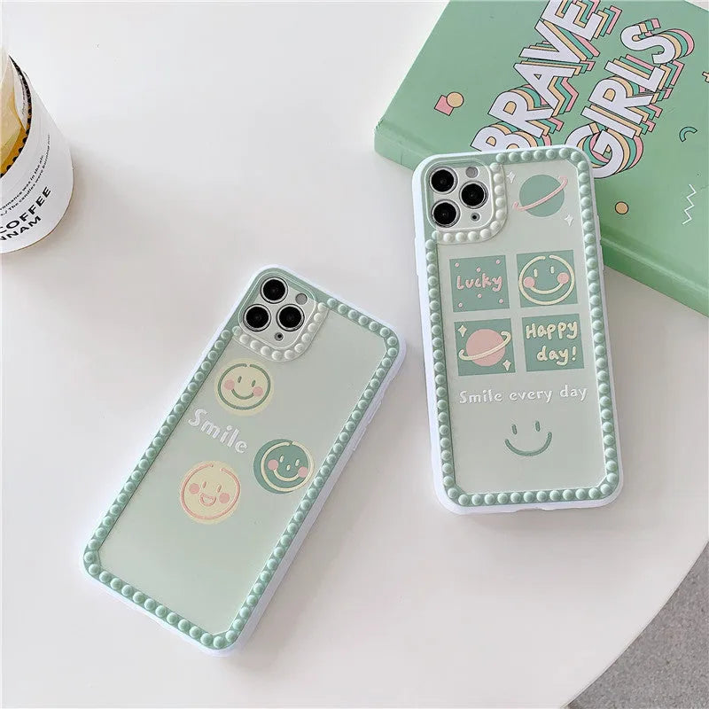 Green TPU iPhone back cover case with geometric smiley face and polka dot frame design.