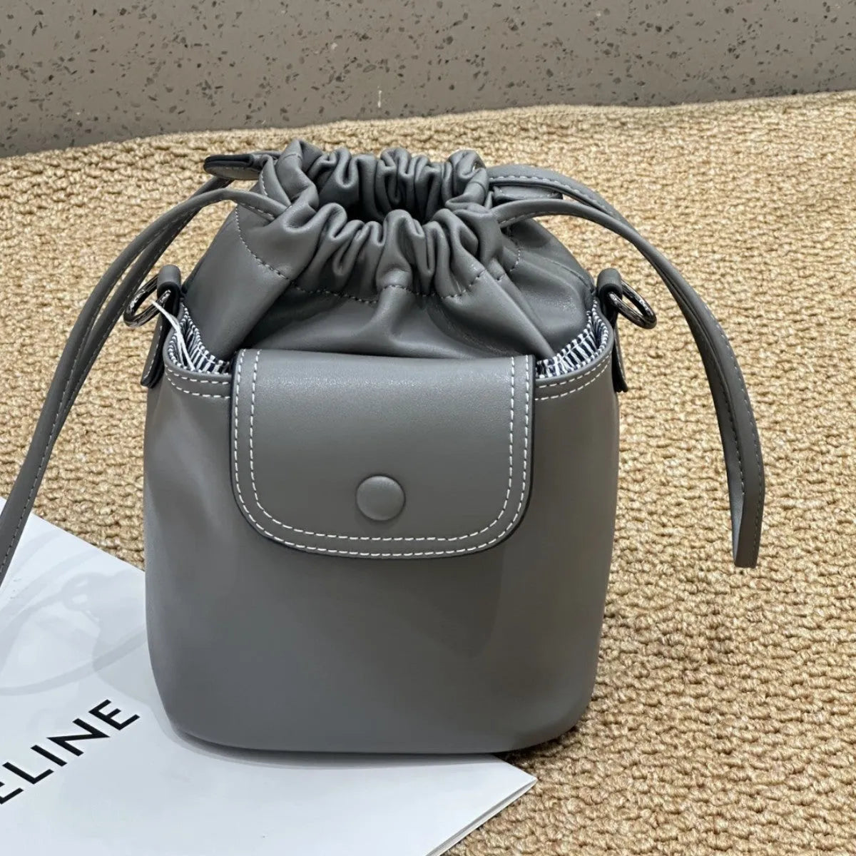 Cortex women's genuine leather bucket crossbody bag in black with drawstring closure and patchwork design, 15 x 20 x 12 cm