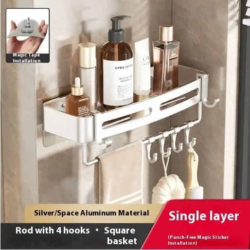 Gun gray punch-free mounted corner bathroom storage rack with towel rod on a white tile wall.