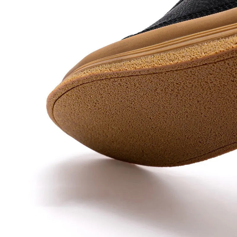 Men's black casual leather shoes with a round toe, lace-up front, and flat rubber sole.