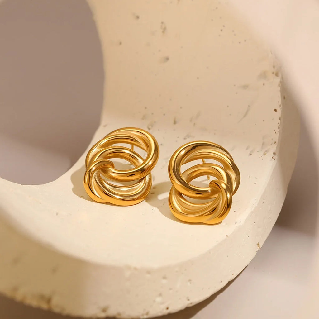 18K gold electroplated stainless steel geometric circle stud earrings on display