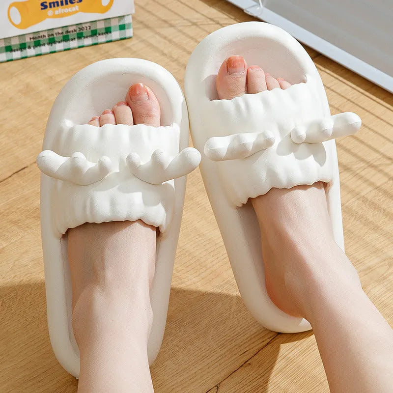 Deer horn design EVA flip flop slippers in light yellow on a non-slip sole.