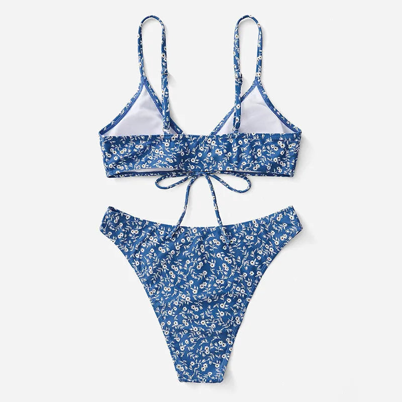 Blue women's swimsuit set with matching top and shorts on a white background.