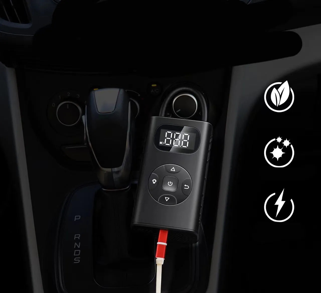 Black rectangular portable tyre inflator and power bank unit with a connected inflation hose on a table.
