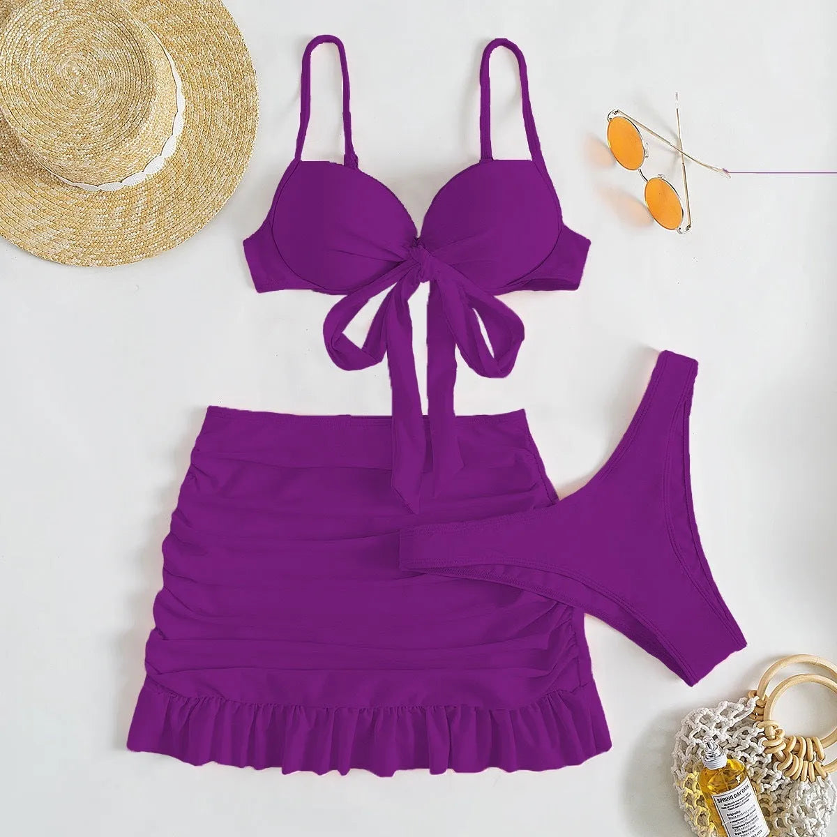 Women's three-piece swimwear set with bow detail in multiple colour options showing waist and hip measurements