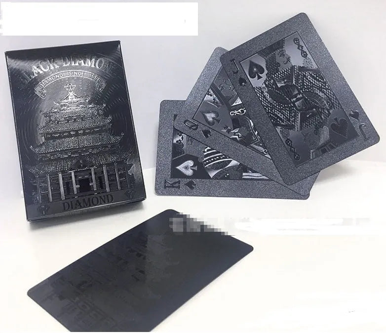 Black Diamond waterproof plastic poker cards with gold foil finish showing laser-etched diamond pattern on black background