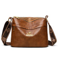 Cross body messenger bag in horizontal square shape with multiple compartments and sandwich pocket construction