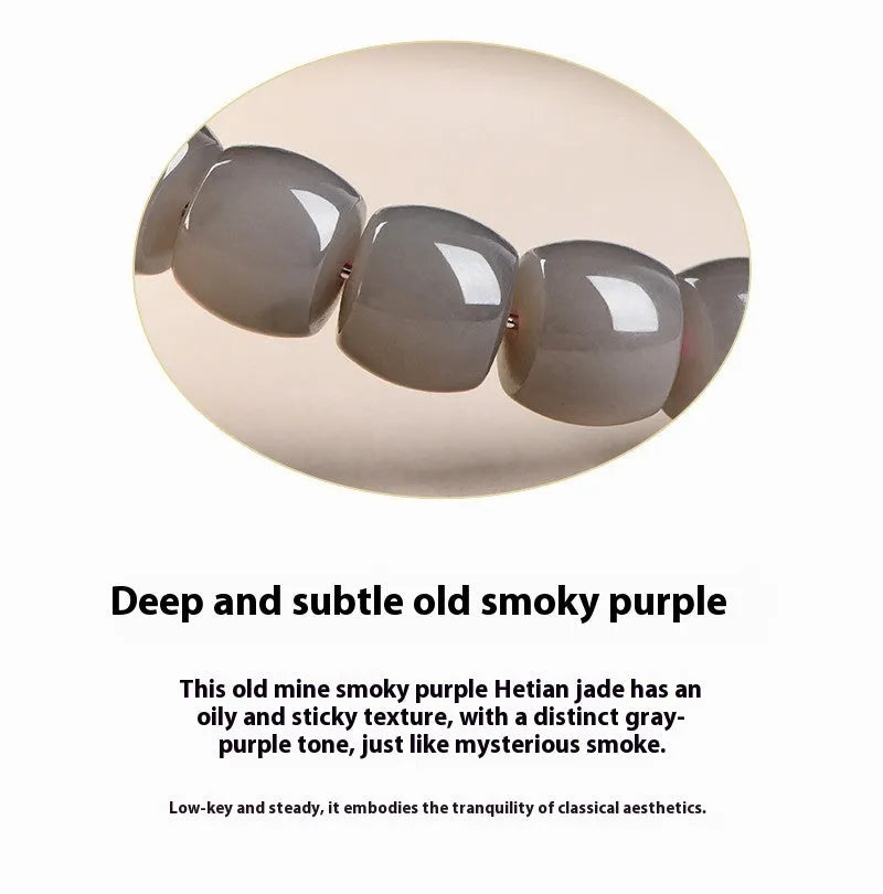 Natural smokey violet Hetian jade straight cut bead bracelet on wrist.