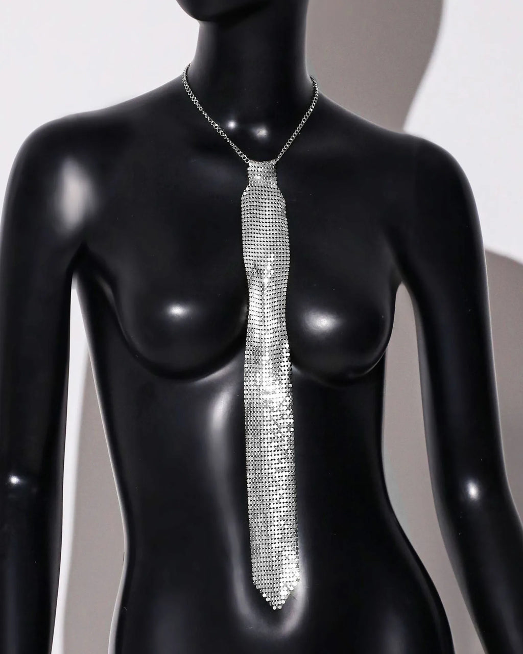 Metallic sequined bow tie in silver colour with arrow design for parties and music festivals