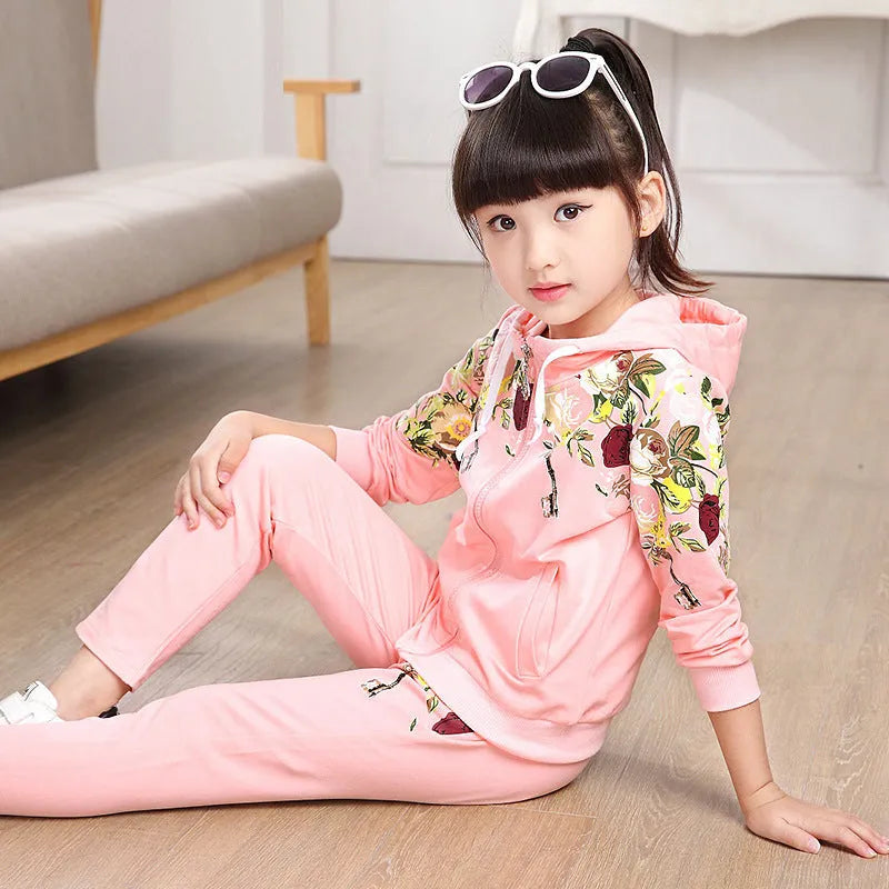 Children's two-piece hooded pants suit set in pink, red, or yellow for spring and autumn wear.