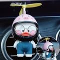 Car air outlet perfume clip in rubber with Oleander Dragonfly design and one size, shown with perfume and accessories