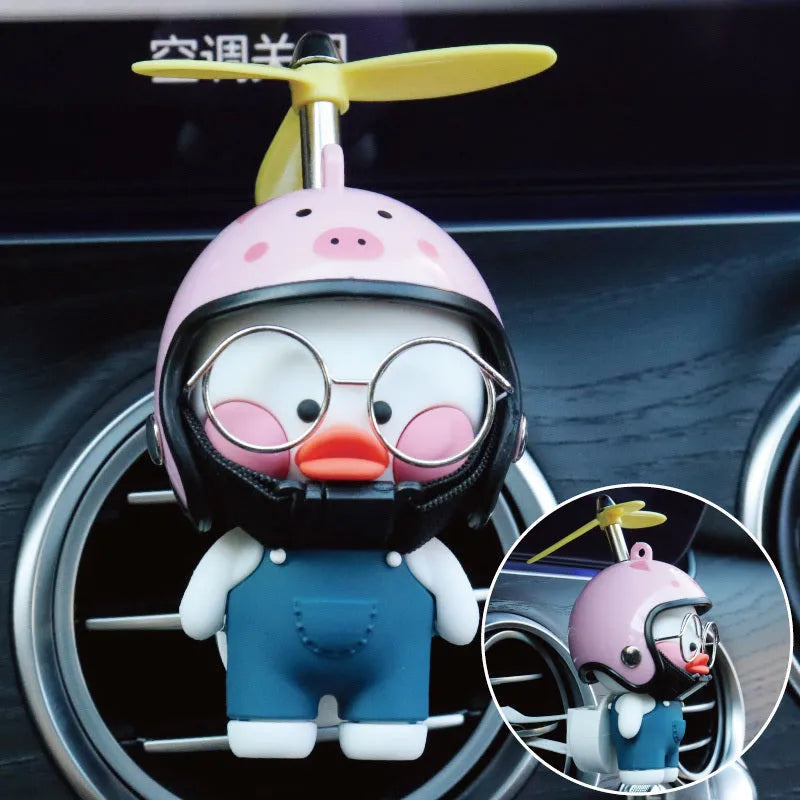 Car air outlet perfume clip in rubber with Oleander Dragonfly design and one size, shown with perfume and accessories
