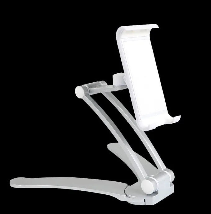 Silver aluminium alloy desktop tablet stand with adjustable clips and 360-degree rotation on a white mount.