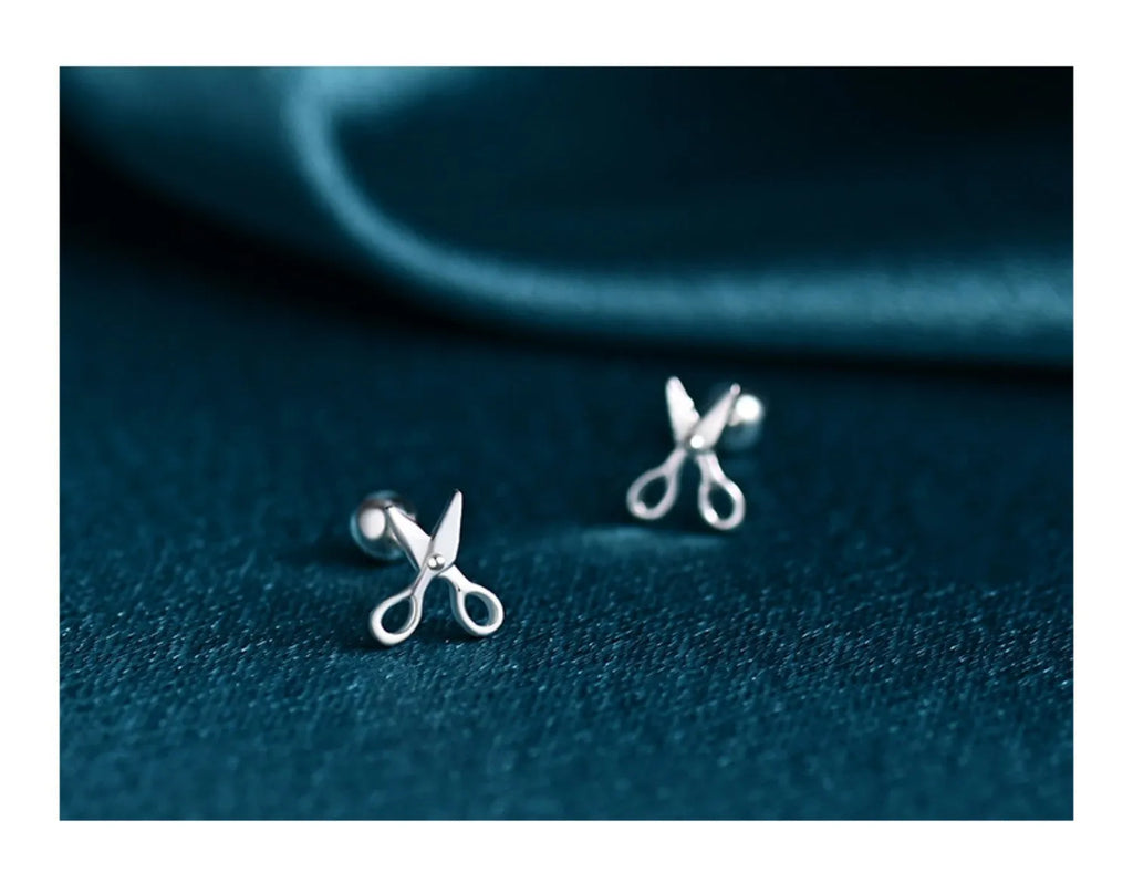 Silver ear nails with screw back closure and mini scissors decorative screw detail