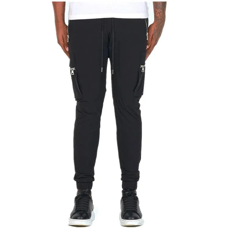 Men's zipper multi-pocket loose casual trousers in black with adjustable belt and small leg opening