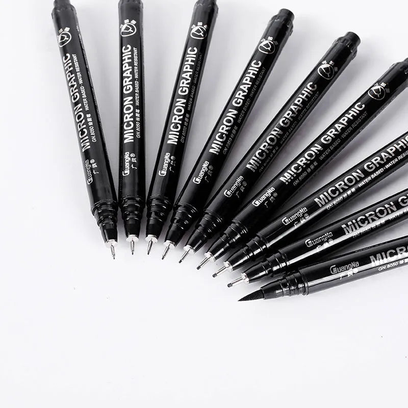 Set of 12 black comic drawing pens with various nib sizes stored in a fabric organiser bag.