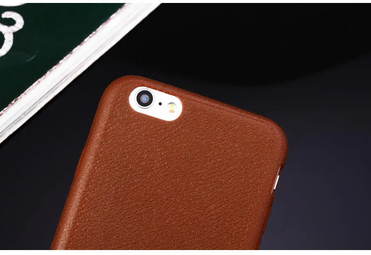 Genuine leather phone case for Apple iPhone in black, shown fitted to an iPhone 11 model.
