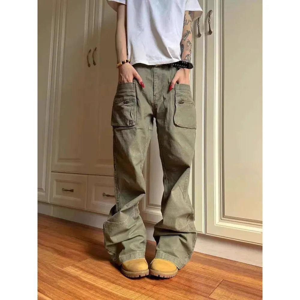 Green and black double zipper casual cotton pants with an elasticated waistband on a hanger.