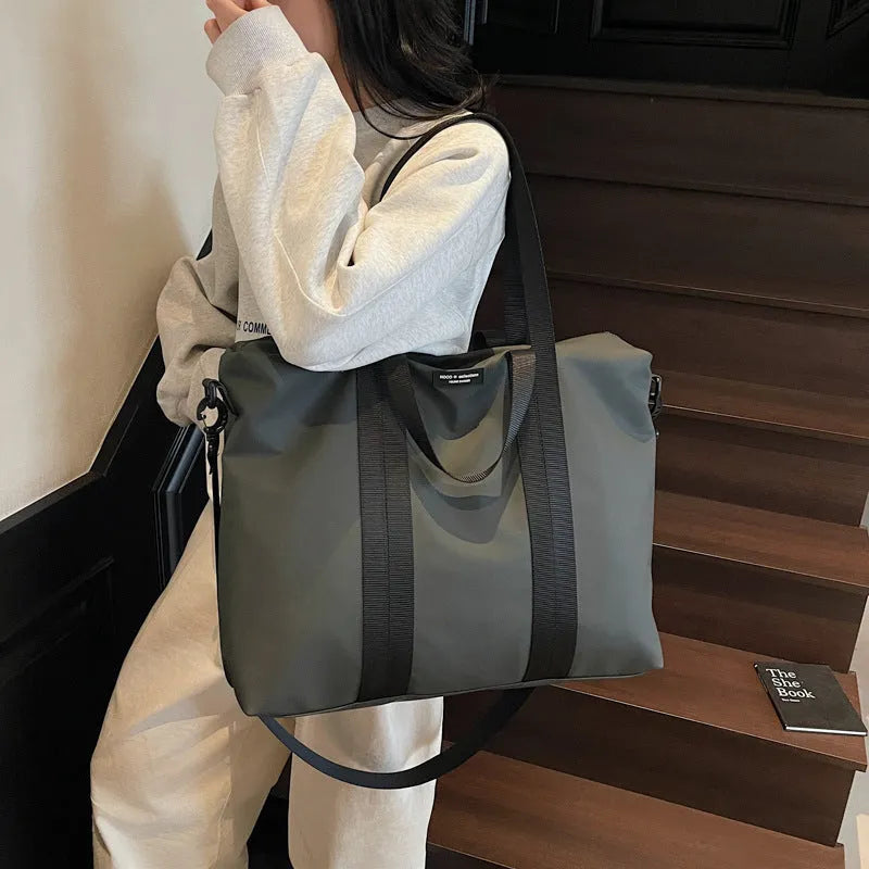 Lightweight Oxford cloth tote bag in black, grey or champagne with 20-35 litre capacity for business travel