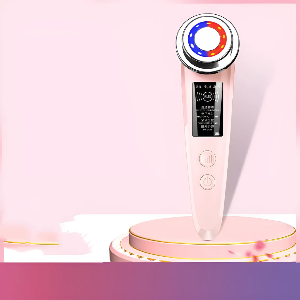 Pink and white rechargeable facial massager with red and blue light therapy functions on a clean surface