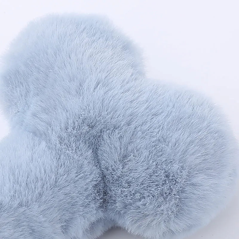 Blue heart-shaped love bone plush dog toy with a squeaker for interactive pet play.