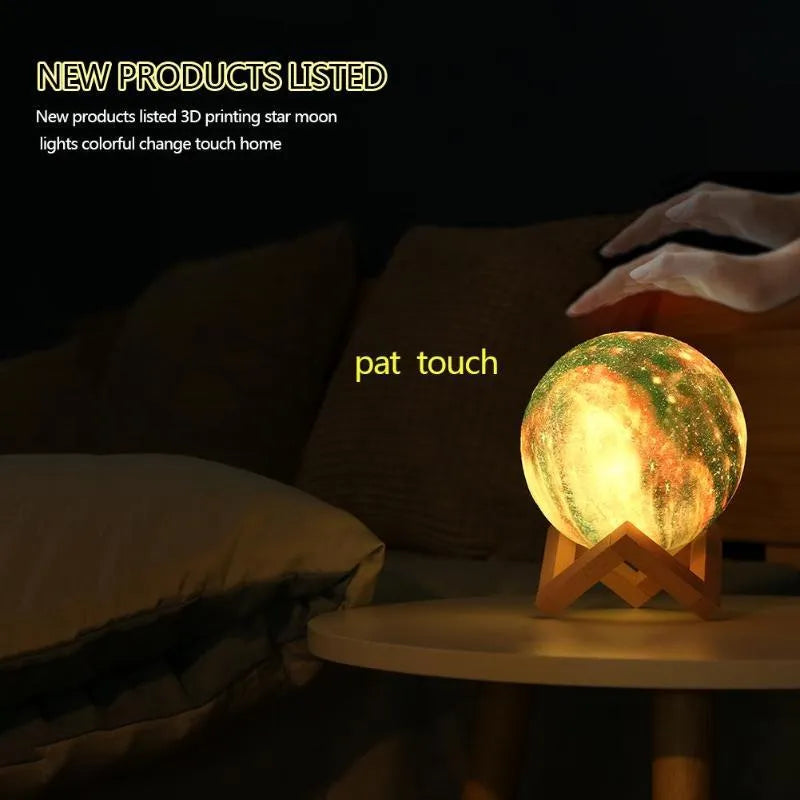 3D-printed lunar sphere night light showing colour-changing LEDs with a remote control.