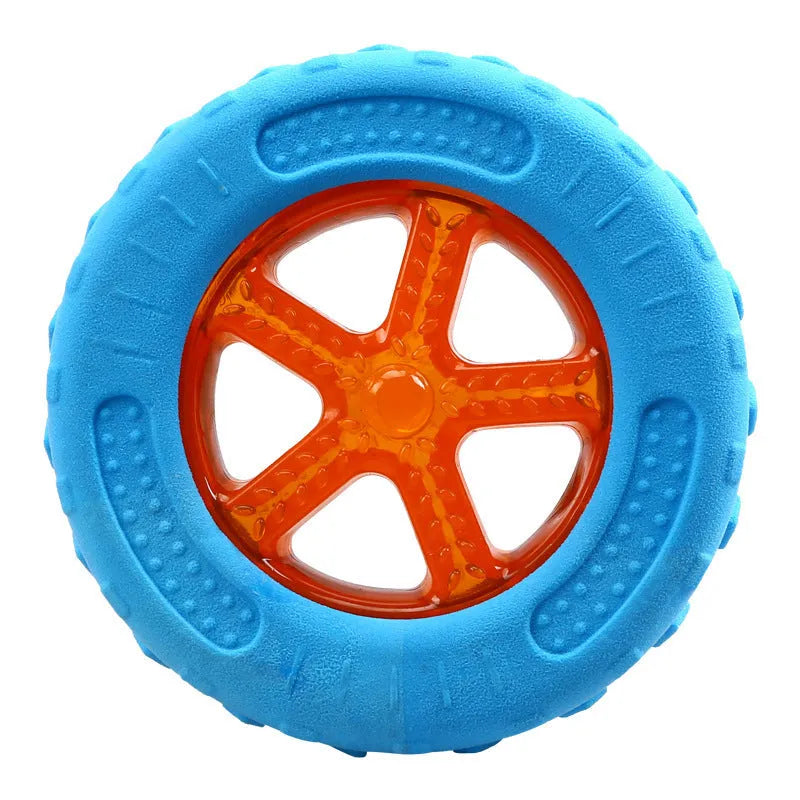 Set of three floating squeaky dog toys: a ball, barbell, and tyre on a blue background.