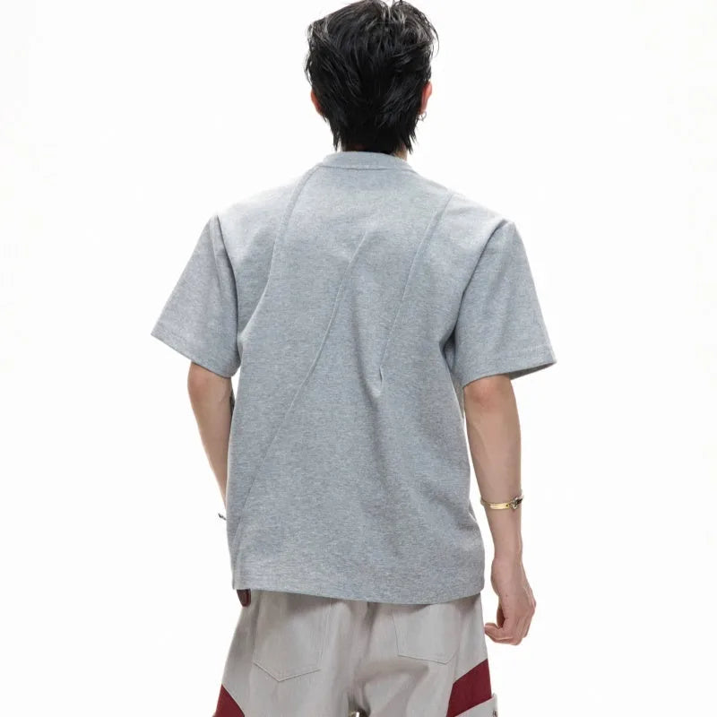 Men's loose fit cotton T-shirt in black with 3D pleated detail and round neck.