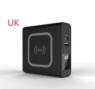 Black Super QI power bank with folding AC plug unfolded, showing wireless charging surface on top.