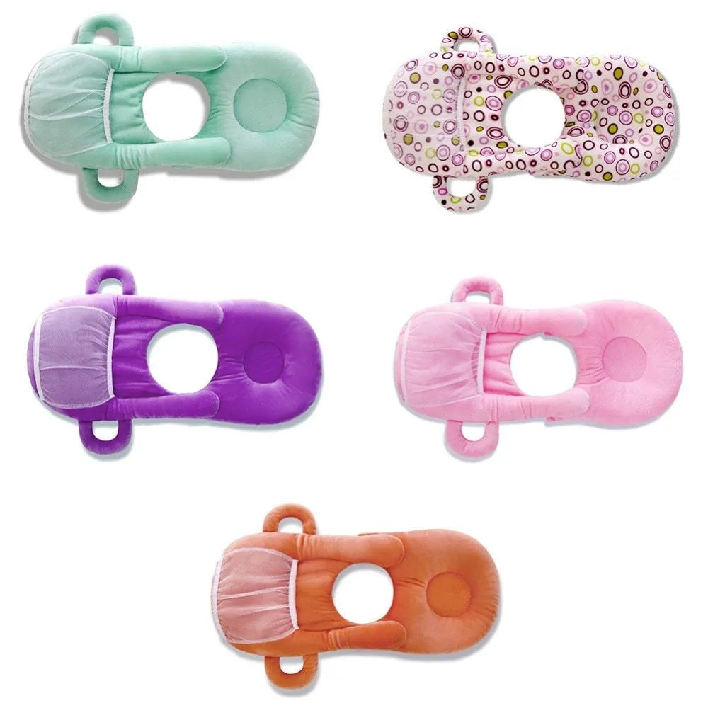 Pink plush baby feeding pillow on a carpet, showing its 30cm by 42cm size and soft texture.
