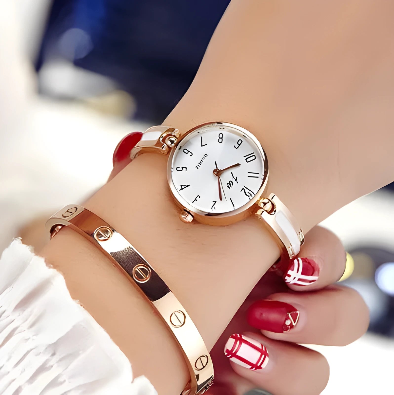 Gold dial quartz watch with steel strap and mineral glass mirror on light background