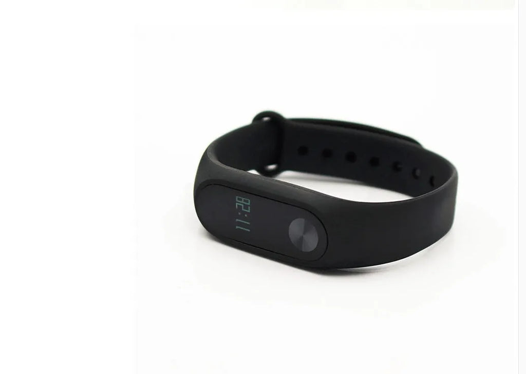 Xiaomi Mi Band 2 black fitness tracker with OLED screen on an adjustable wrist strap.