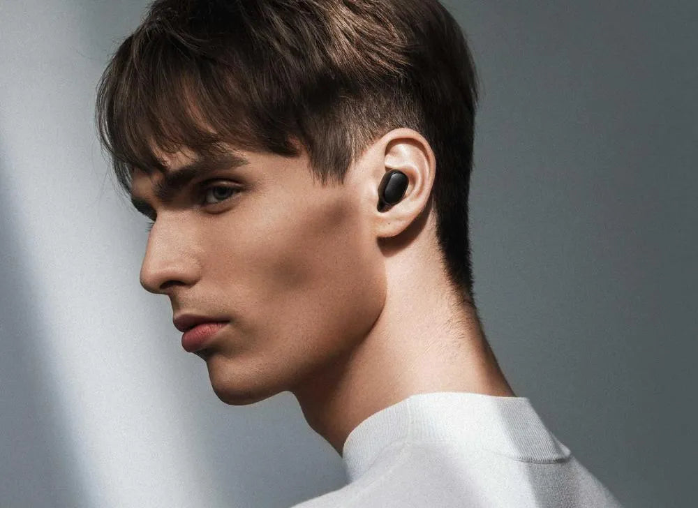 Redmi AirDots 2 black true wireless earphones and charging case on a white background.