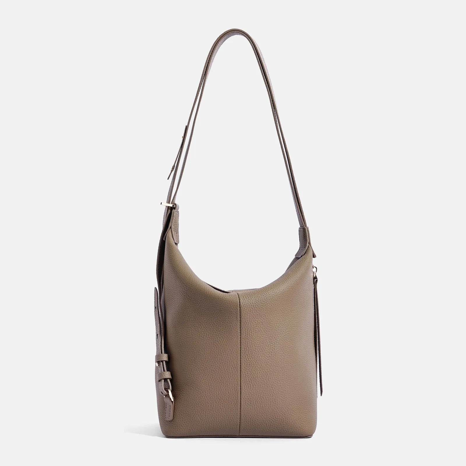 Women's large grey genuine leather bucket bag with a soft handle on a casual outfit.