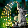 Grey resin elephant garden statue with textured finish and integrated LED lighting, 60cm tall.
