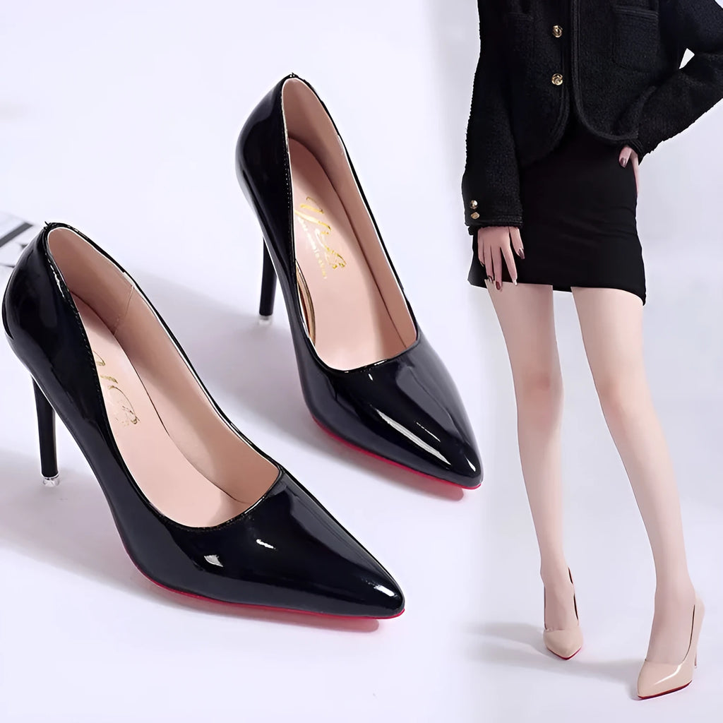 Women's black stiletto heel pump with pointed toe and shallow mouth on a rubber sole.