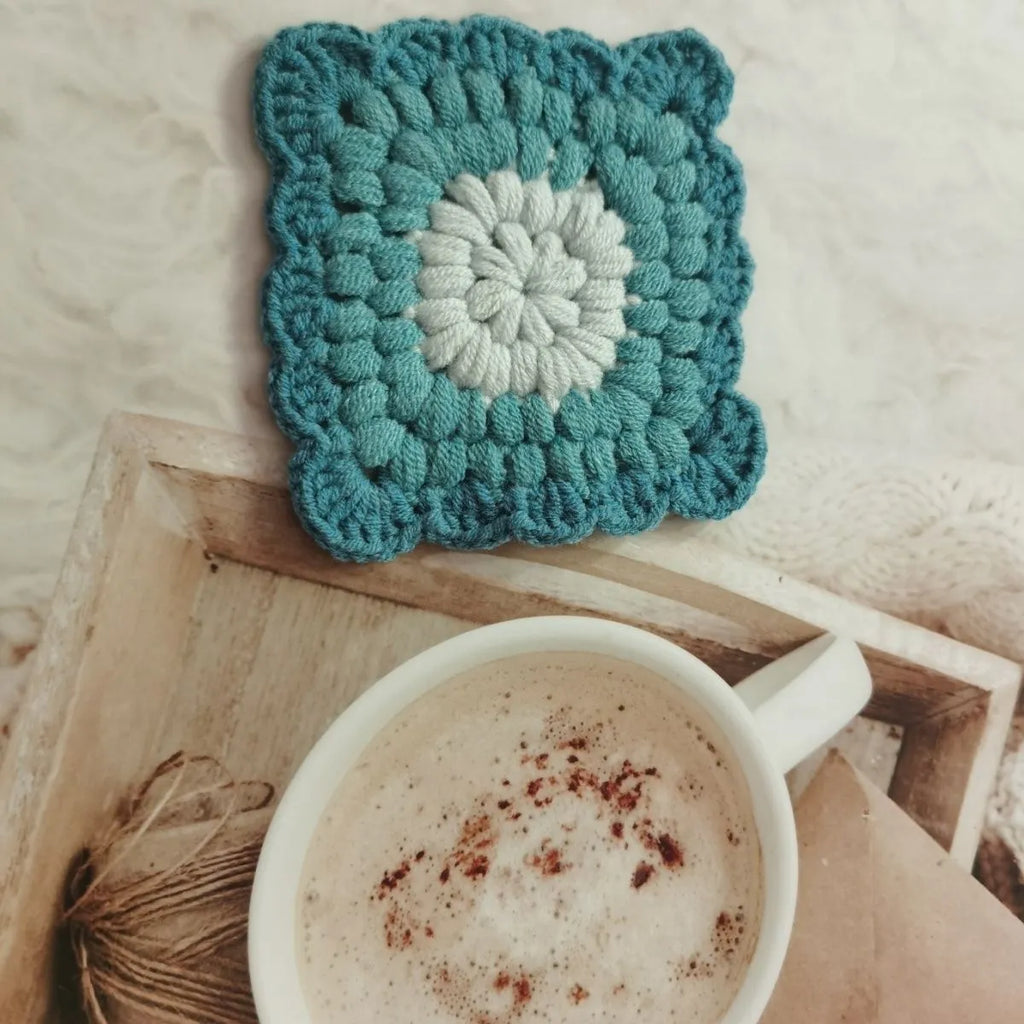 Crocheted wool cup placemat with Grandmother Lattice pattern in chosen colour