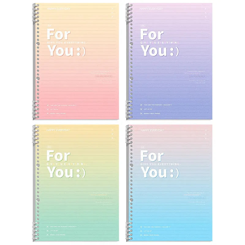 Gradient coloured removable coil spiral notebook in A4 and B5 sizes on a desk.