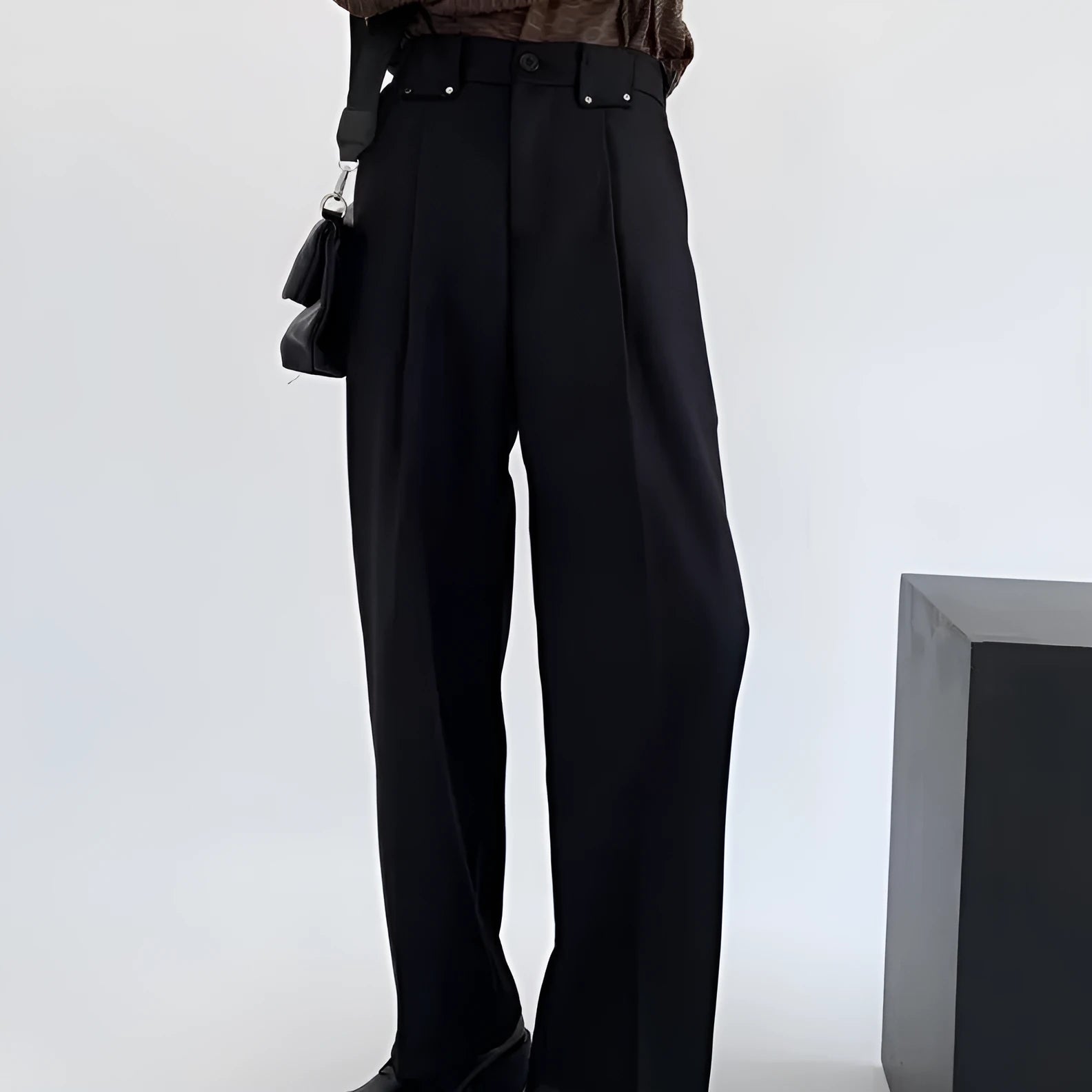 Women's black high-waisted cropped suit pants with draping effect, sizes M-3XL, on display