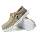 Men's casual canvas shoe in green with mosaic detail and rubber sole, shown from the side.