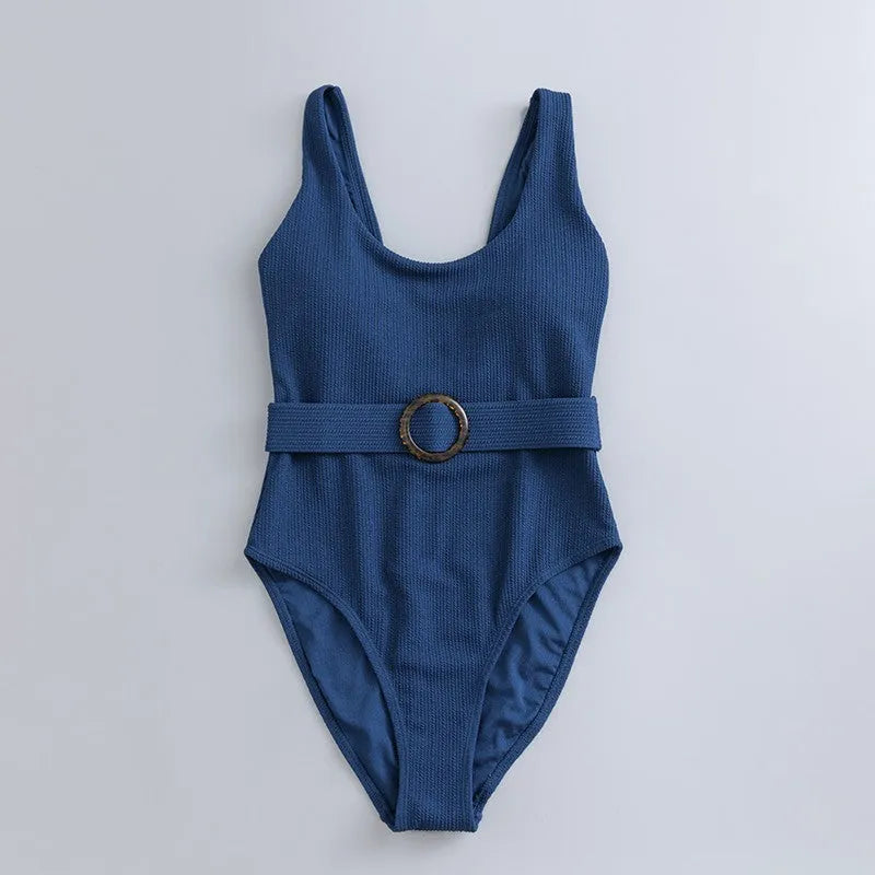 Navy blue women's one-piece swimsuit with triangle cut and chest pads on size chart