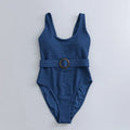 Navy blue women's one-piece swimsuit with triangle cut and chest pads on size chart