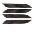 Four black carbon fibre pattern adhesive door handle protectors for a Tesla Model S.