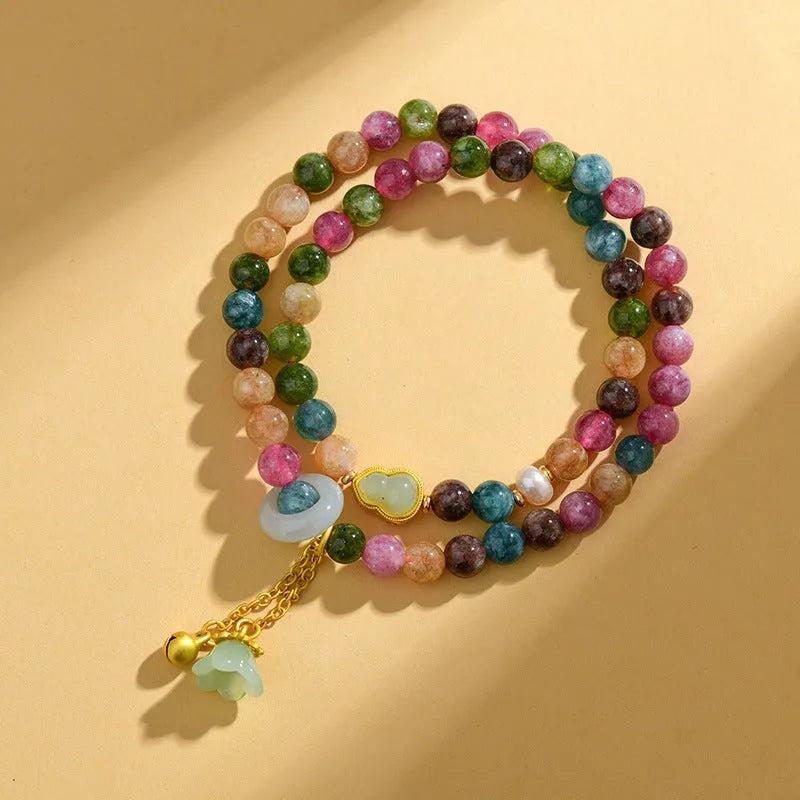 Close-up of a women's double ring bracelet made from round natural chalcedony crystal beads.