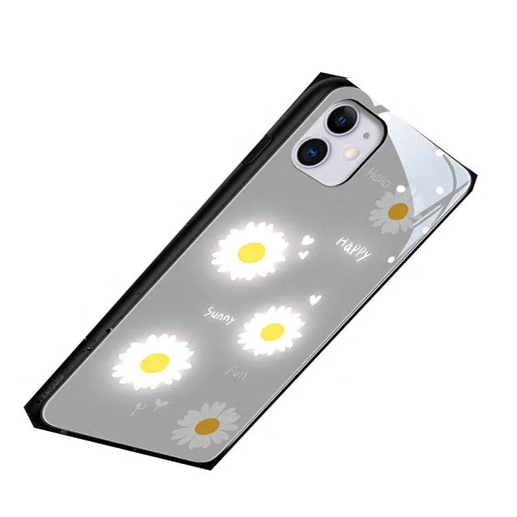 White luminous iPhone case with painted daisy design and voice-activated colour light feature.