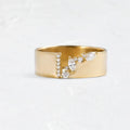 Gold plated women's ring with a shining zircon stone on a model's hand.