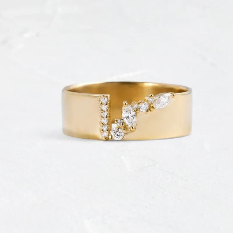 Gold plated women's ring with a shining zircon stone on a model's hand.