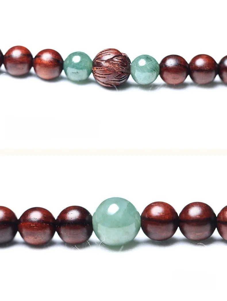 Traditional rosewood prayer bracelet with 108 beads, carved Pterocarpus santalinus decoration, and Hotian jade pendant